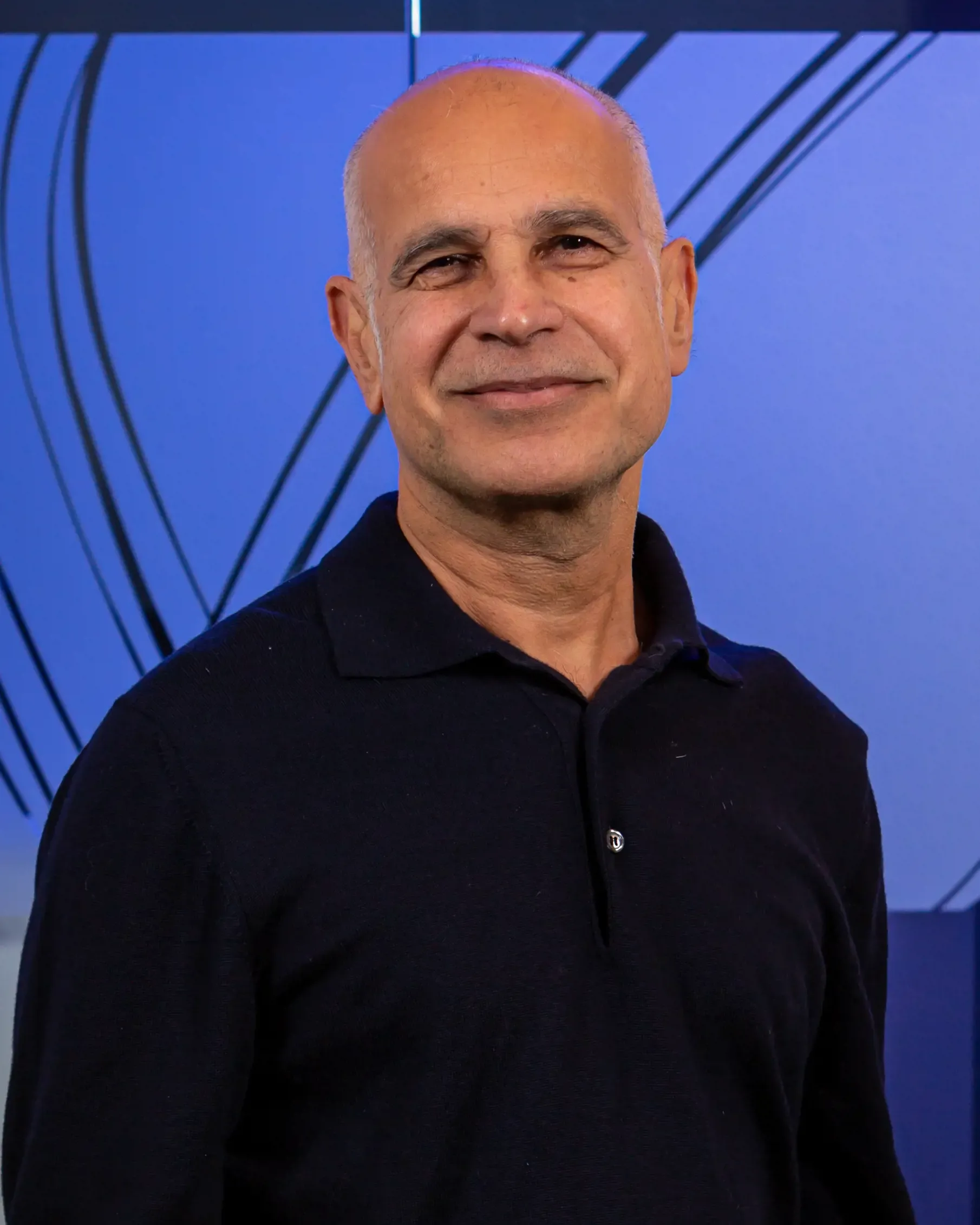 A bald man in a black shirt